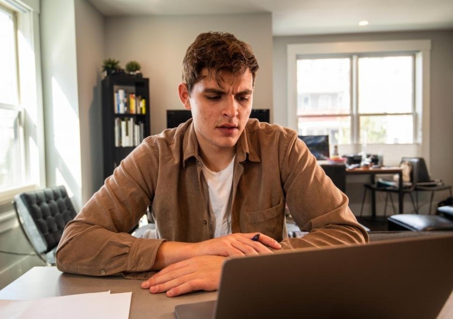 young-man-thinking-with-laptop.jpg