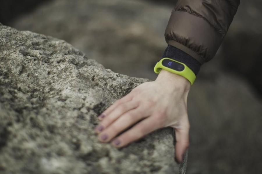 green-fitness-tracker-on-a-wrist-outdoors.jpg
