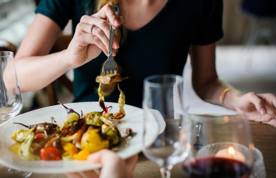 woman-eating-plate-of-food-with-fork.jpg