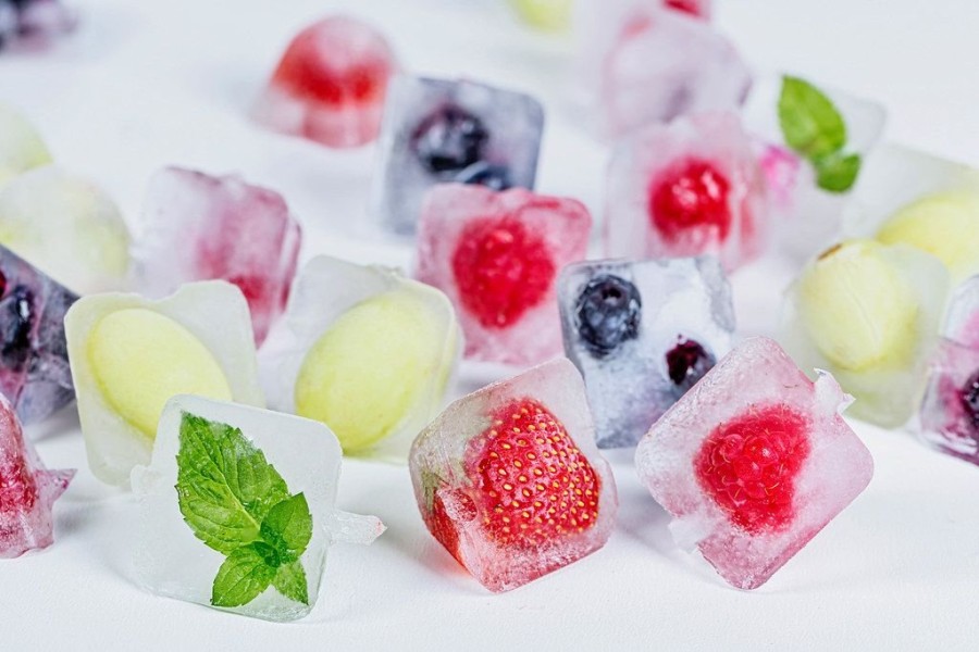 ice-cubes-with-different-fruits-mint-and-berries-frozen-inside.jpeg