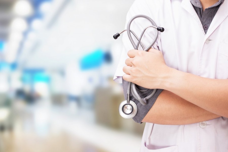 doctor-with-stethoscope-hands-hospital-background.jpg
